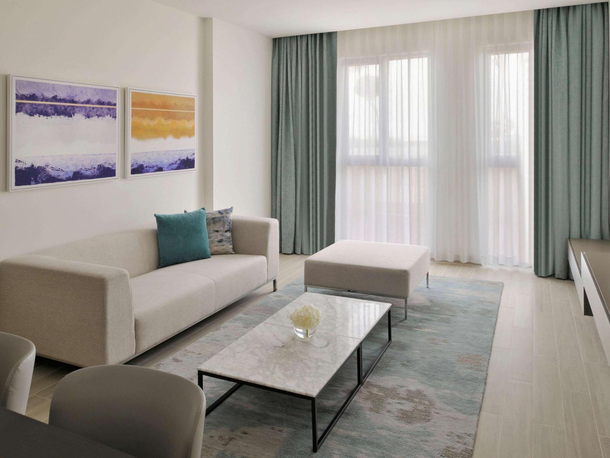 Moevenpick Hotel & Apartments Ghala Маскат Экстерьер фото A living room